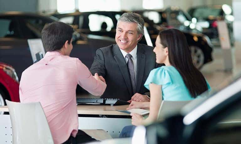 Couple Making Deal with sales associate