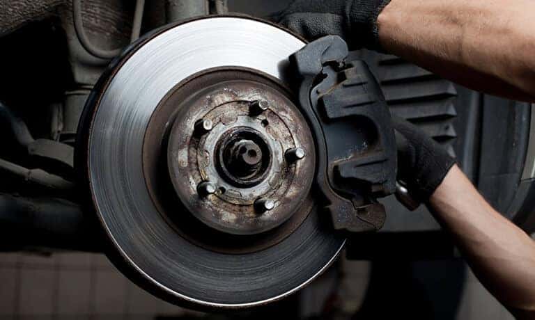 Mechanic changing brake pads