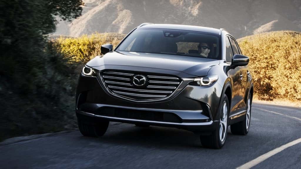 2017 Mazda CX-9 driving down a mountainous road