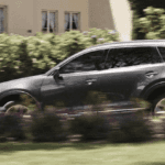 Mazda CX-9 SUV driving fast in suburbs
