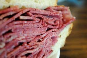 Up close photo of a corned beef sandwich