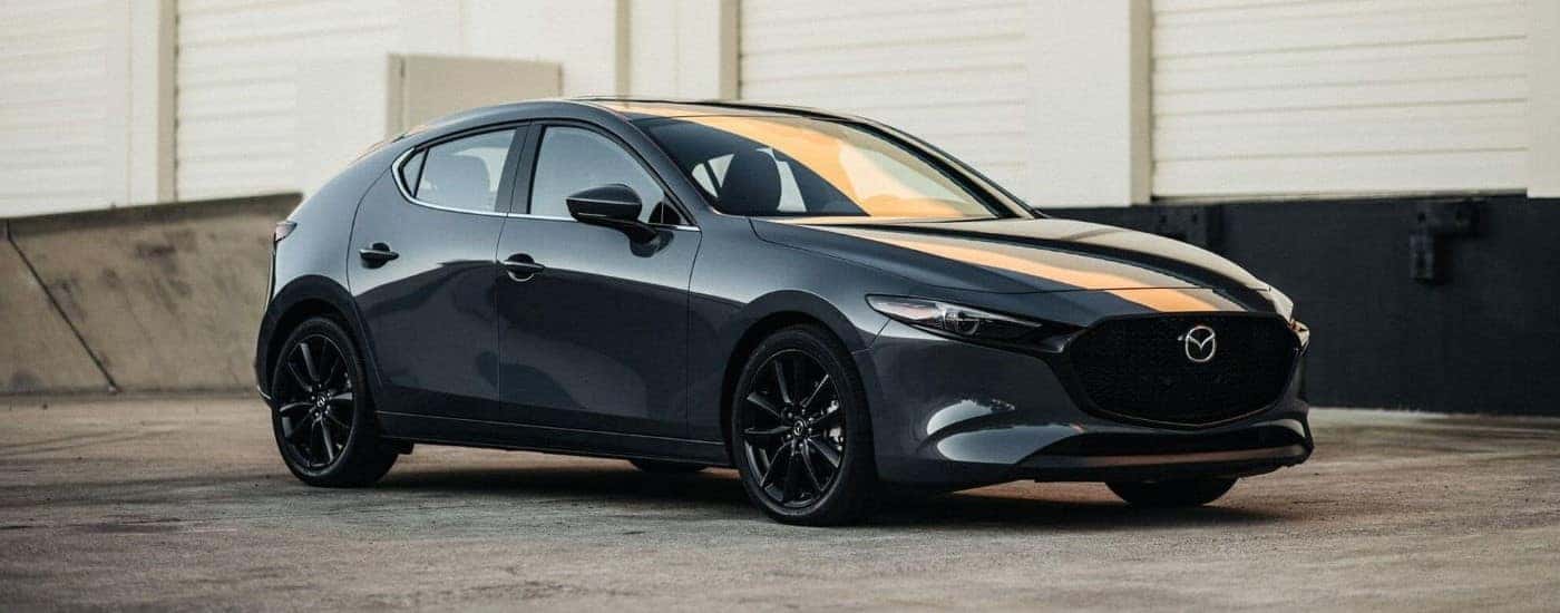 A gray 2023 Mazda3 is shown parked after viewing a used Mazda for sale.