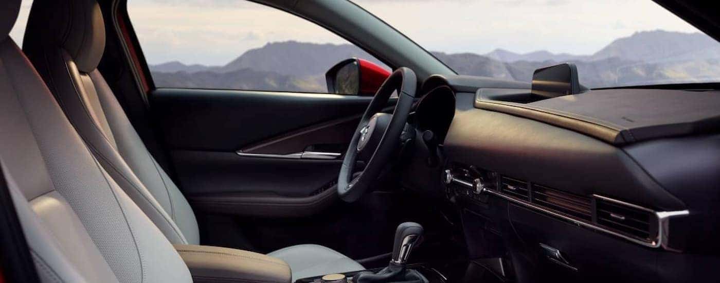 The black interior and dash are shown in a 2025 Mazda CX-30.