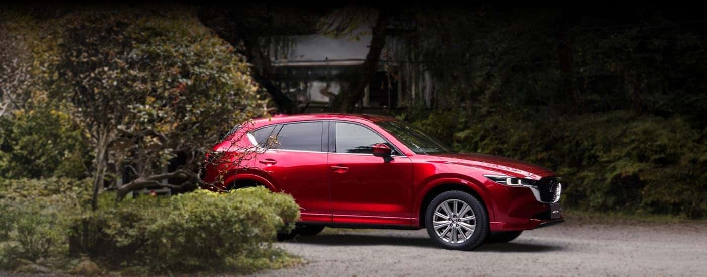 Red 2025 Mazda CX-5 parked on a driveway