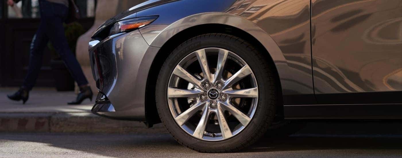 Close-up of a wheel on a grey 2026 Mazda3