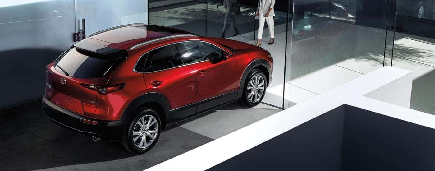 Red 2023 Mazda CX-30 at a dealership