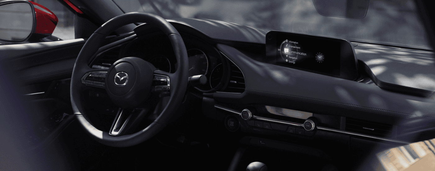 Infotainment system and steering wheel of a 2026 Mazda3 for sale near East Hartford