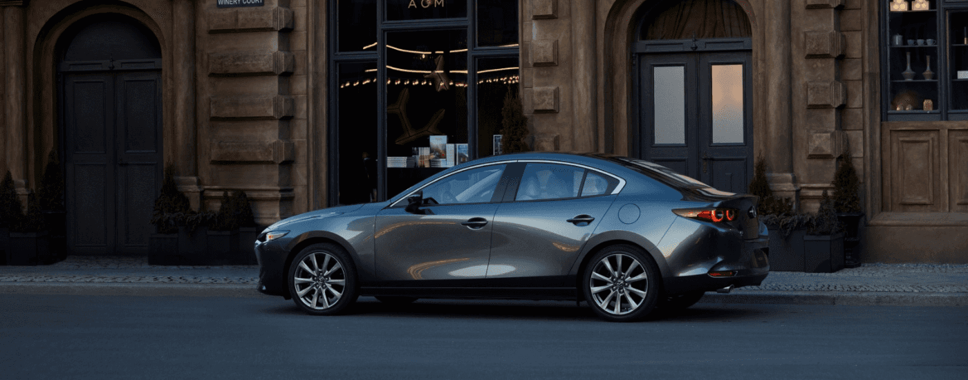 Grey 2026 Mazda3 parked on the street