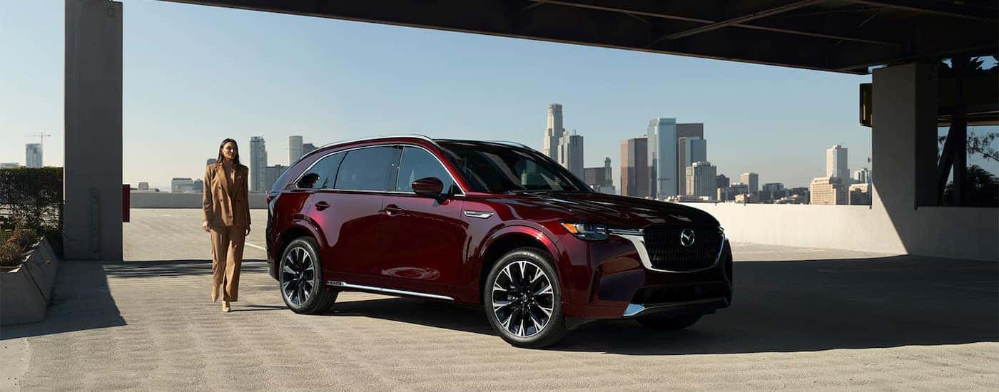 A maroon 2025 Mazda CX-90 from the front.