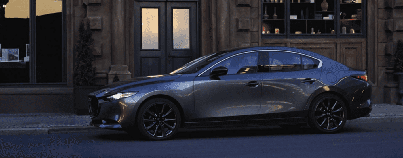 Grey 2026 Mazda3 Sedan parallel parked