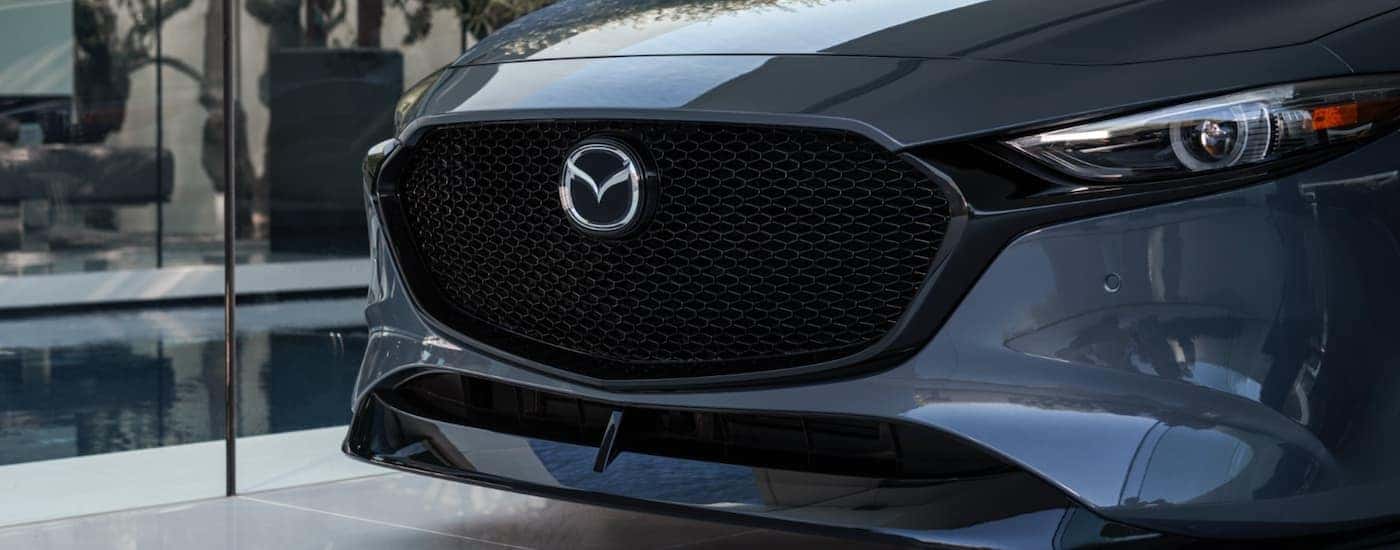 The grille of a gray 2025 Mazda3.