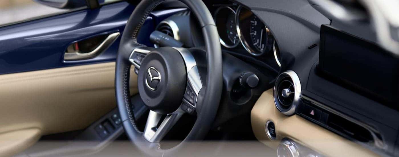 Close-up of the steering wheel in a 2026 Mazda MX-5 Miata.