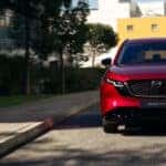 Red 2026 Mazda CX-5 for sale driving on a city street