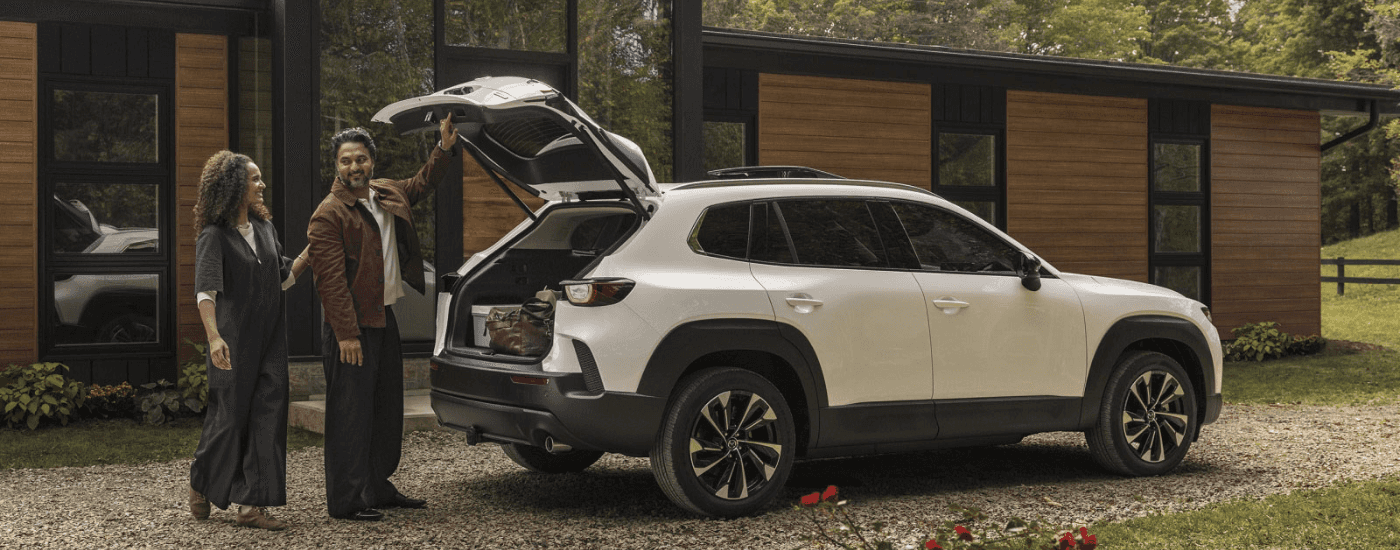 The open trunk of a white 2026 Mazda CX-50