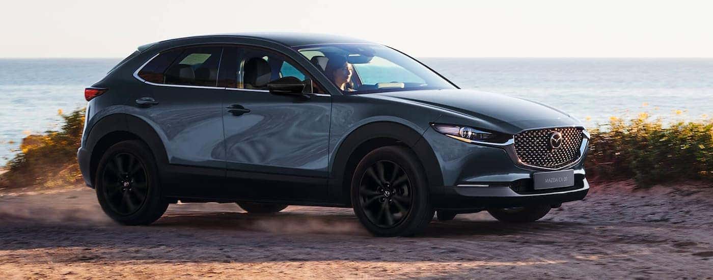 Grey 2023 Mazda CX-30 parked near the ocean