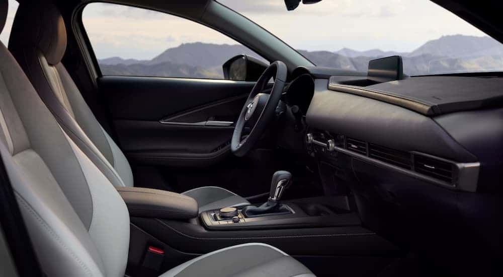 Steering wheel and dashboard inside a 2026 Mazda CX-30