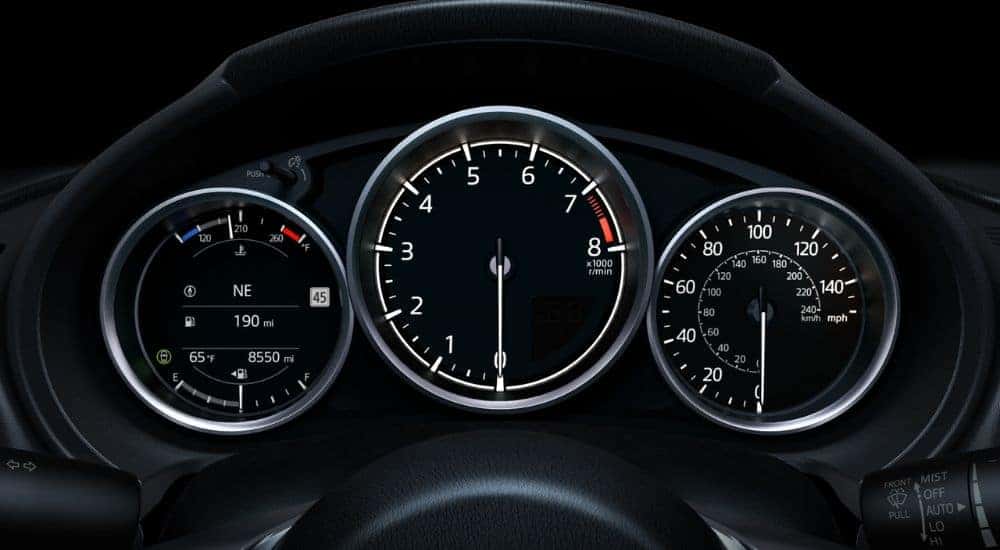 Gauge cluster and part of steering wheel on a 2026 Mazda MX-5 Miata.