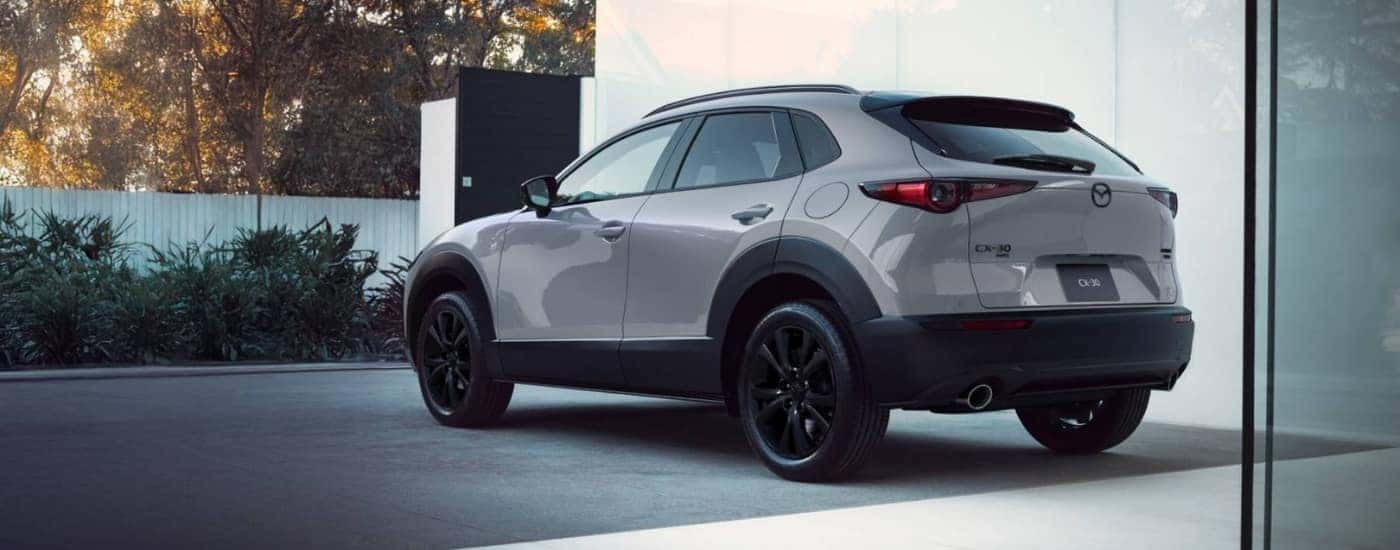 Grey 2026 Mazda CX-30 parked near a showroom