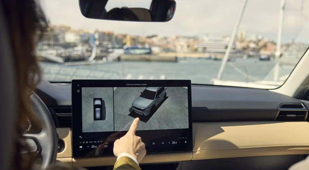 A person using the surround view monitors in a 2026 Mazda CX-5.