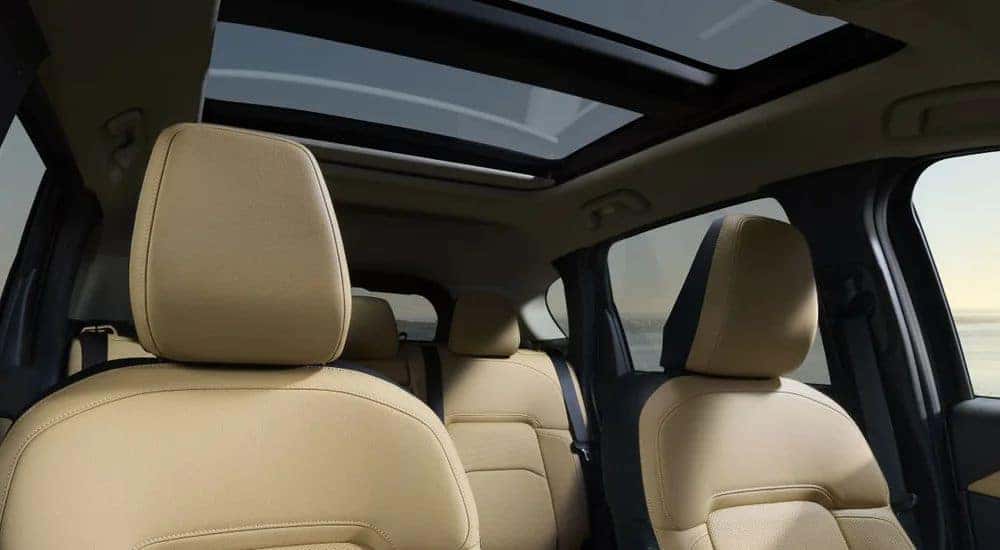 Tan leather seats and sunroof in a 2026 Mazda CX-5.
