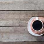 Person holding a cup of coffee
