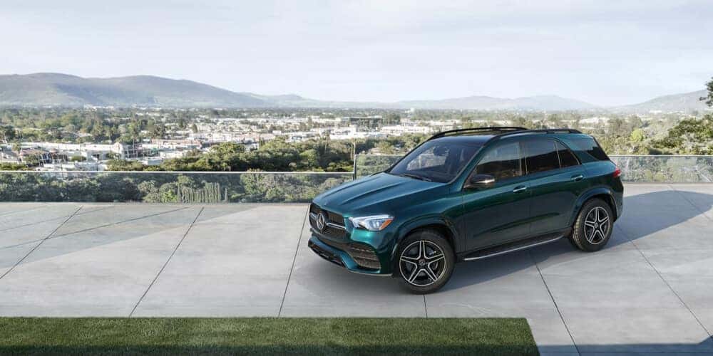 2021 Mercedes-Benz GLE parked on sidewalk overlooking a city