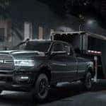 2019 Ram 2500 towing trailer at nighttime