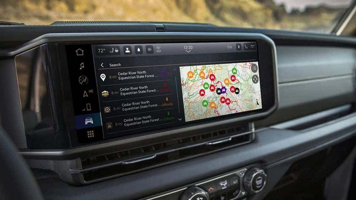 2026 Jeep Wrangler Uconnect touchscreen showing the Trails Offroad trail-guide map feature