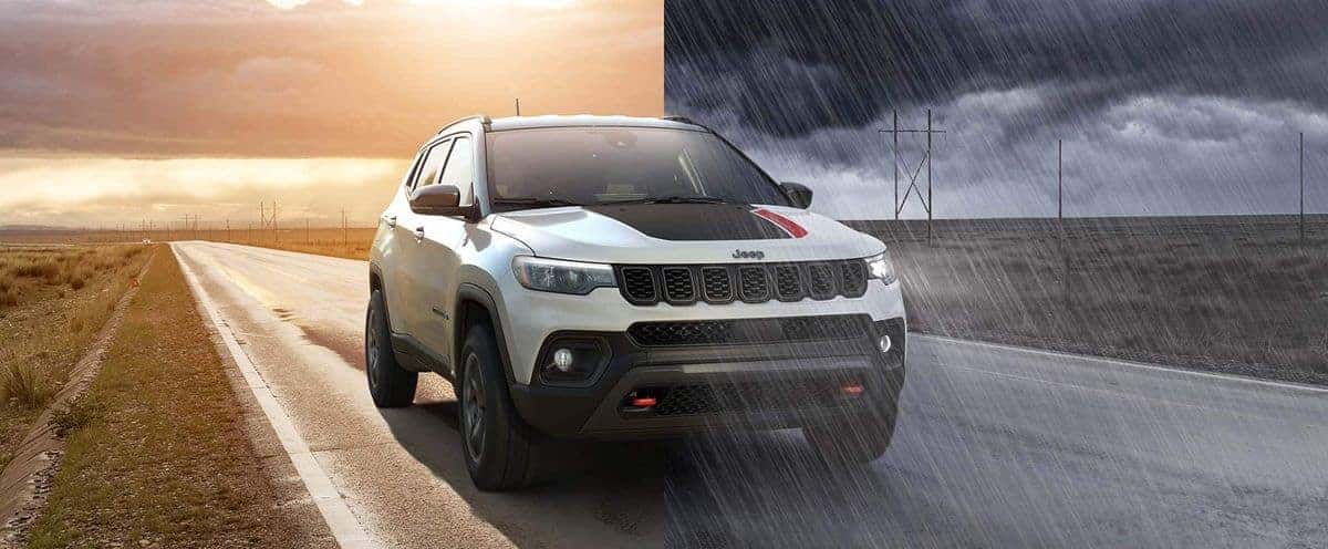 2026 Jeep Compass driving through changing weather conditions from sun to rain