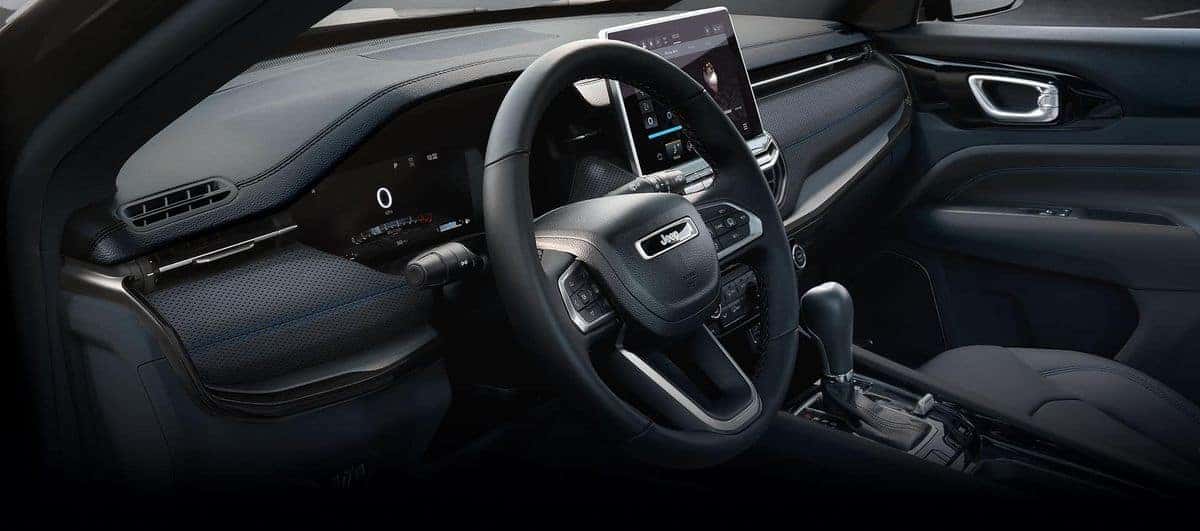 2026 Jeep Compass interior dashboard with Uconnect 5 touchscreen and steering wheel