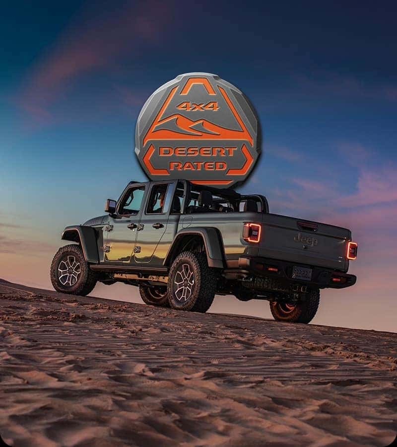 2026 Jeep Gladiator Mojave with the Desert Rated badge on a sand dune