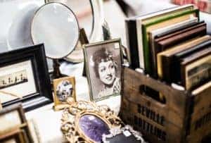 an old picture surrounded by other antiques