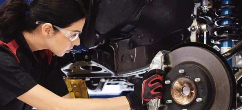 Technician repairing breaks.