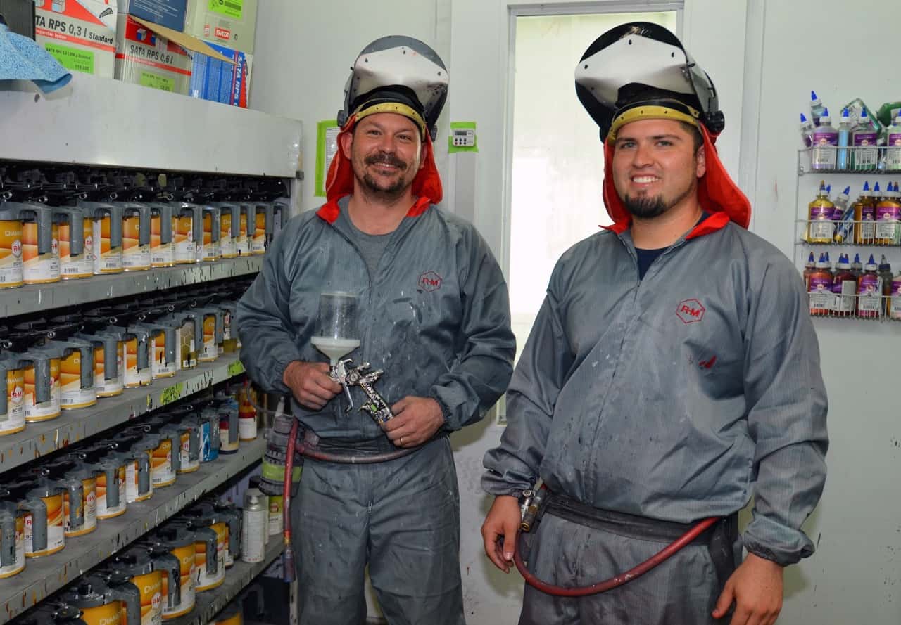 Two Precision Toyota Collision Center painters in the paint mixing room