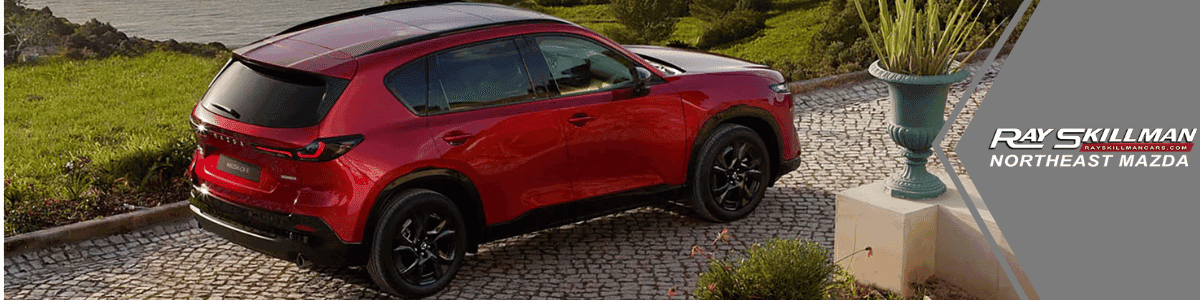 Mazda CX-5 Trim Level Breakdown - banner image showing a red CX-5 in a driveway
