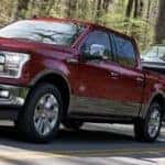 2019 Ford F-150 King Ranch in Ruby Red towing boat