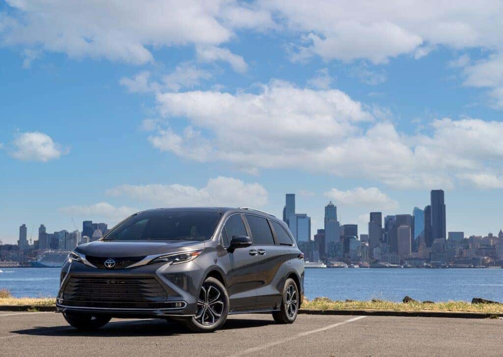 Toyota Sienna Parked Front 3/4 View in Front of a City Skyline