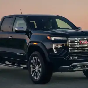 2026 GMC Canyon Onyx Black driving on a road