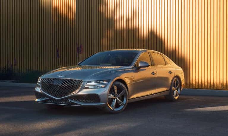 2024 Genesis G80 Exterior Near Wood Wall With Flowers