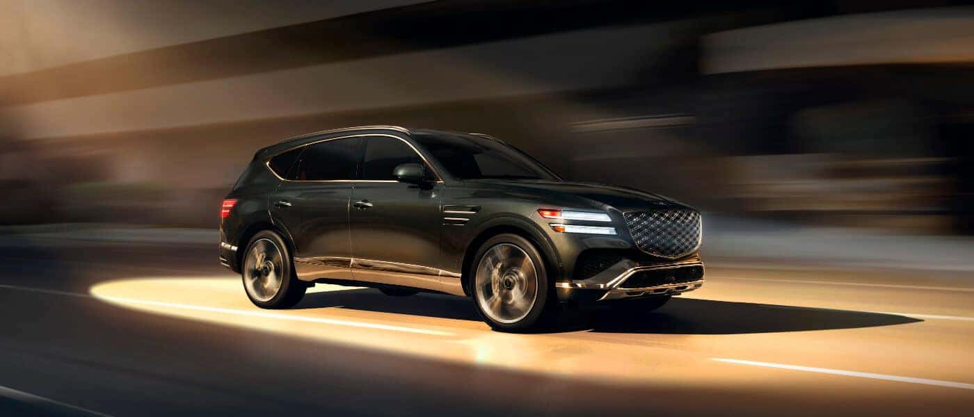 2025 Genesis GV80 Exterior Driving In Light Beam