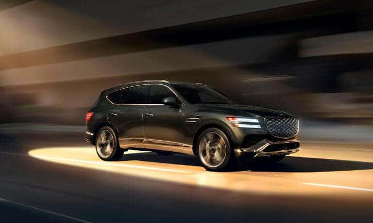 2025 Genesis GV80 Exterior Driving In Light Beam