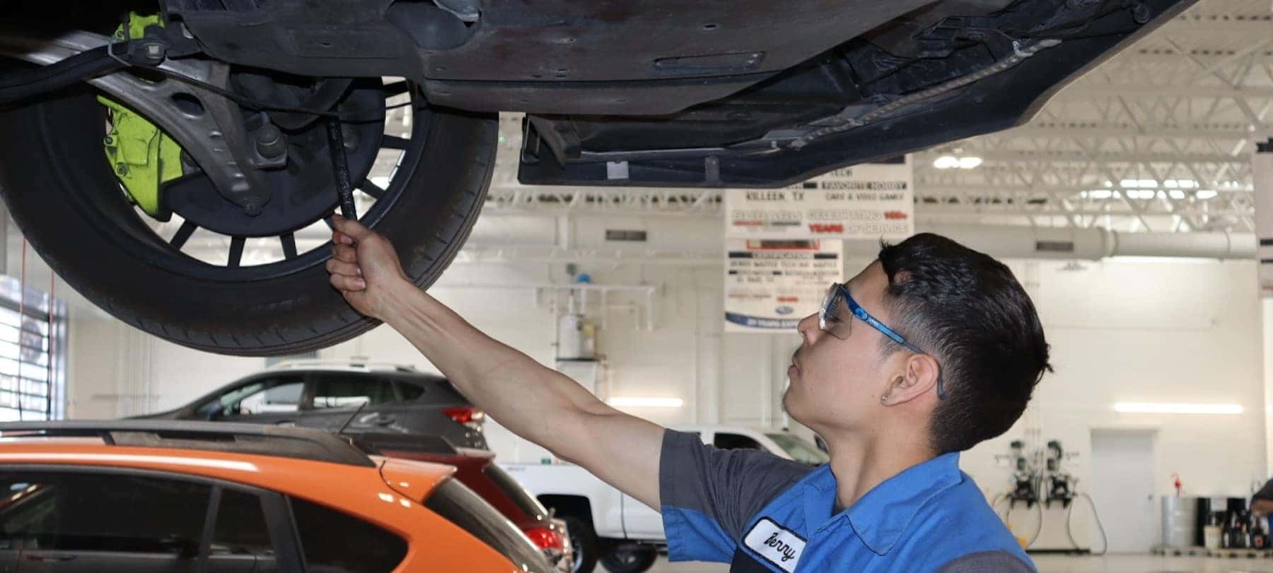 Mechanic reviews a car repair_mobile