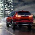 Rear View of Red 2018 Honda CR-V Driving at Night