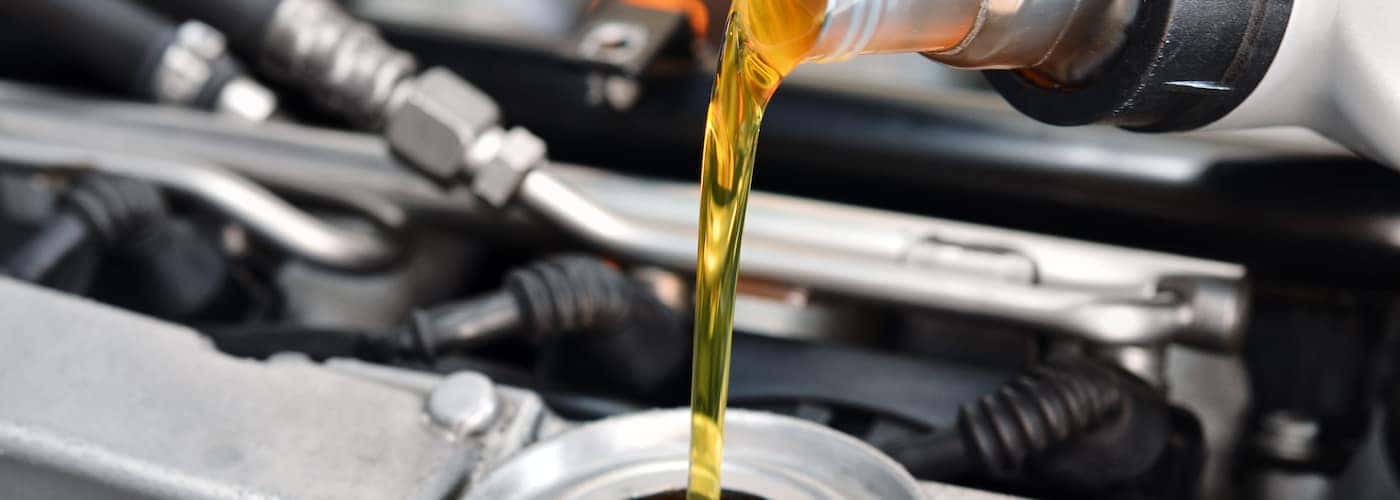 Pouring Oil Into Resrevoir
