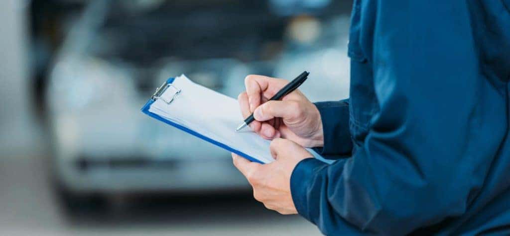 mechanic with clipboard