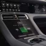 8.4-inch center console control panel of the Porsche Taycan showing the remaining charge and driving range