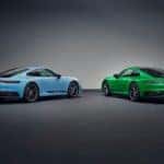 Rear view of two Porsche 911 Carrera T models, one in blue, one in green