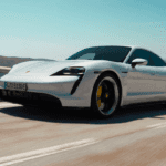 Porsche Taycan Driving on road during the day