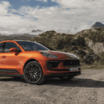 2023 Porsche Macan parked on hill with mountains in background