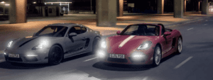 Two 2024 Porsche 718 driving side by side